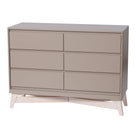 Modern 6-drawer double nursery dresser with cross-beam base and hidden drawer pulls made of solid New Zealand pine.