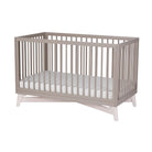 Modern 4-in-1 convertible crib made of solid New Zealand pine that grows with the baby. 