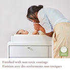 Lifestyle shot of a mom and baby featuring the non-toxic coating and Baby Safety Alliance verification.