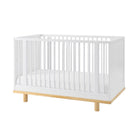 Little Seeds Roo Collection 4-in-1 convertible crib, hero shot on a clean white background showcasing its two-tone base, round spindles, and wide accent slats.